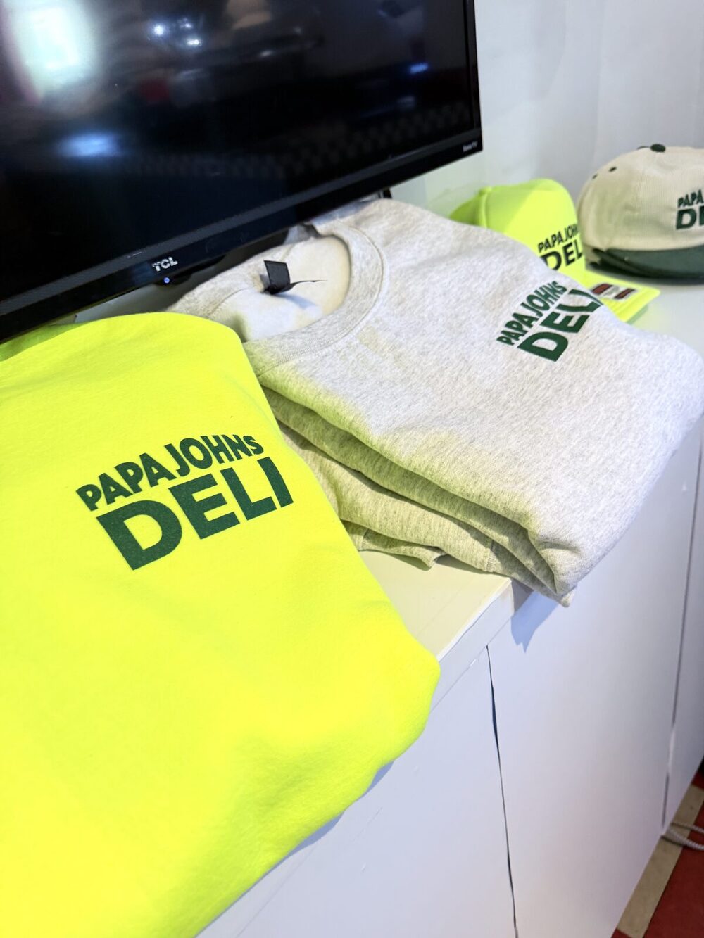 Freshly printed company branded apparel folded and ready for pickup
